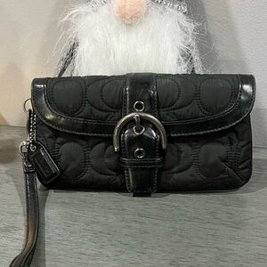 Elegant Coach Black Quilted Women's Clutch/Wristlet with gunmetal hardware.